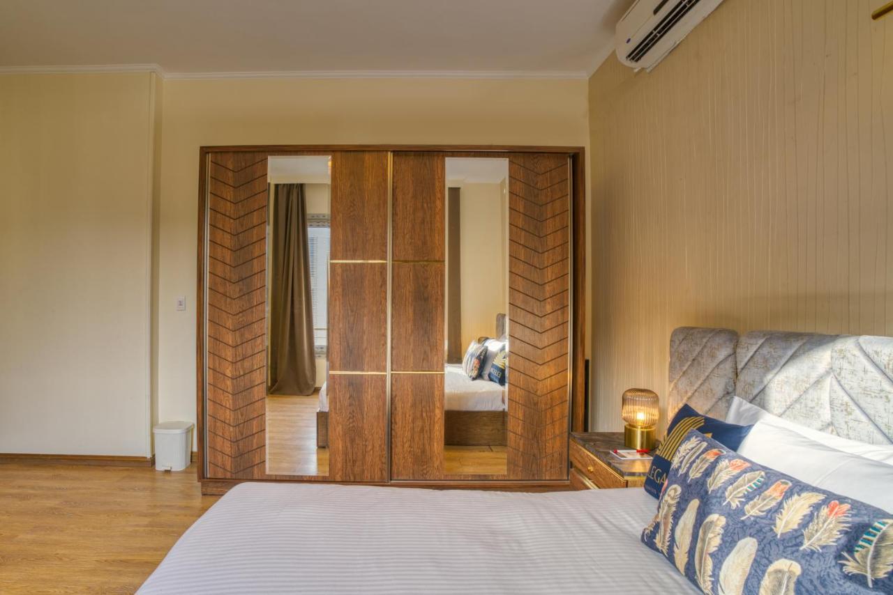 The Suites Near Auc By Elegant Kairo Bagian luar foto