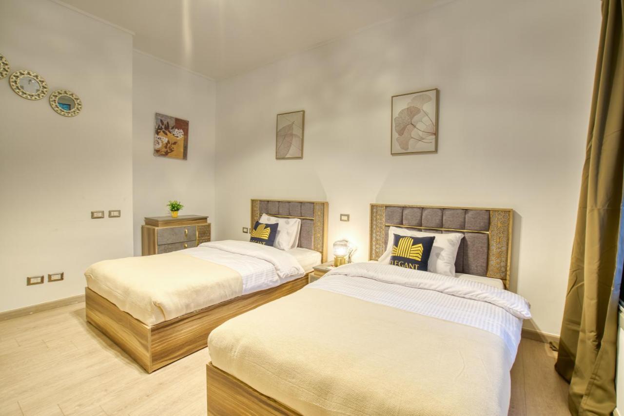 The Suites Near Auc By Elegant Kairo Bagian luar foto